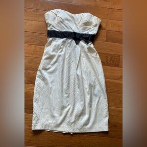 Le chateau Elegant Cream Dress with Black Bow